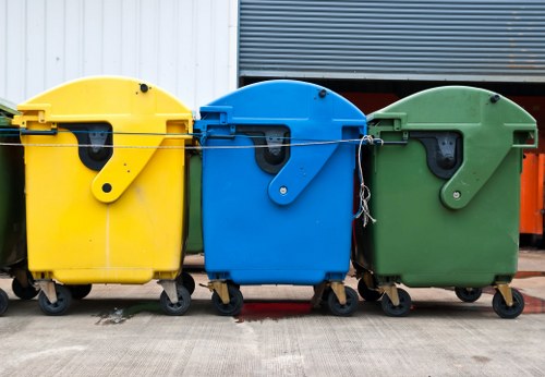 Builders loading waste for clearance in Vauxhall site