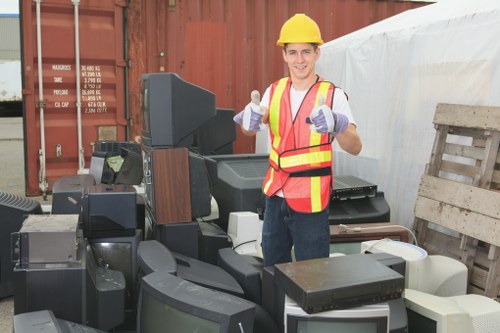 Efficient house clearance workers removing items from a property